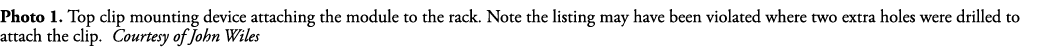 Photo 1  Top clip mounting device attaching the module to the rack  Note the listing may have been violated where two   