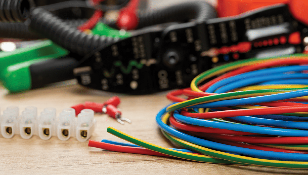 Tools for electrician needs: voltage testers, wire strippers, pliers, cables,