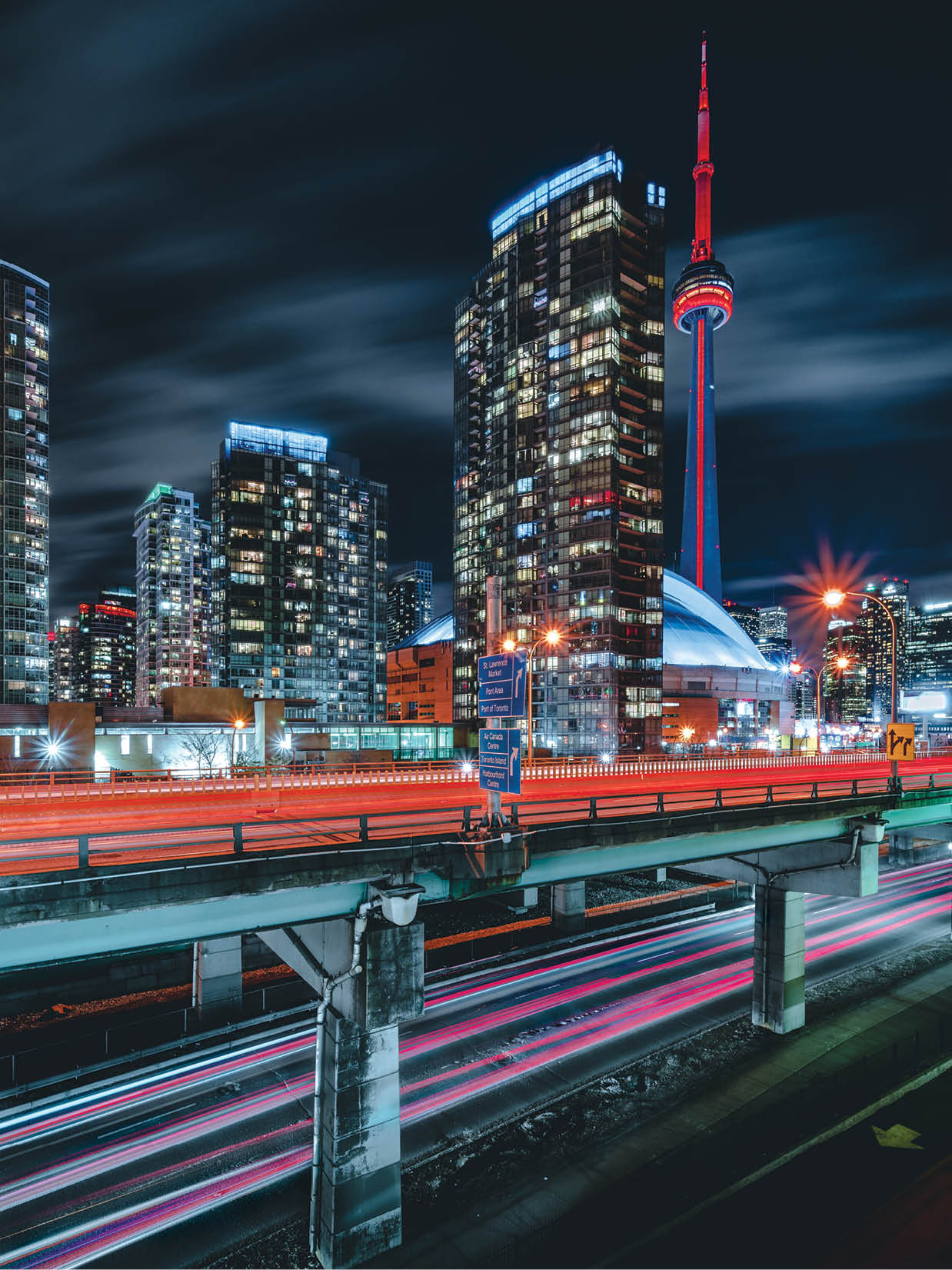 Epic futuristic and modern skyline views of downtown Toronto with the Gardiner Highway leading your eye to office buildings and condominiums 