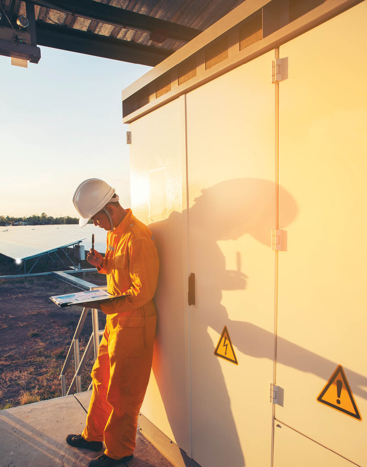 Male Electricity Engineer inspect and maintenance electric power system in generator at solar plant  Technician checklist work and service on switchgear at substation control 