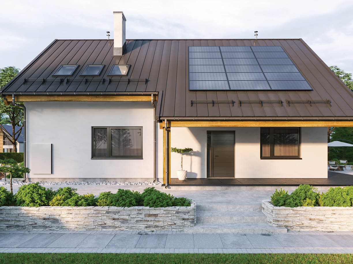 Modern house with solar panels and wall battery for energy storage 
