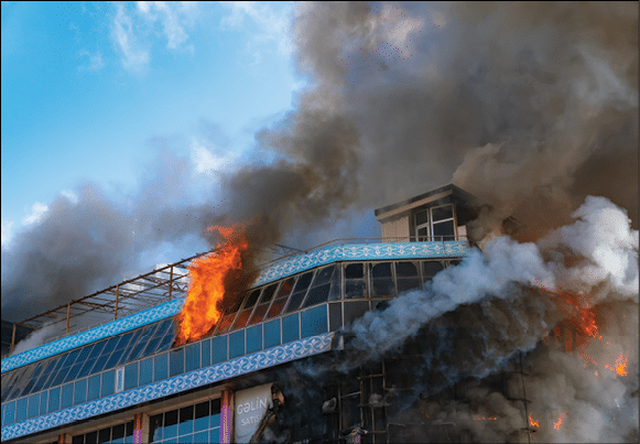 Burning building in thick smoke