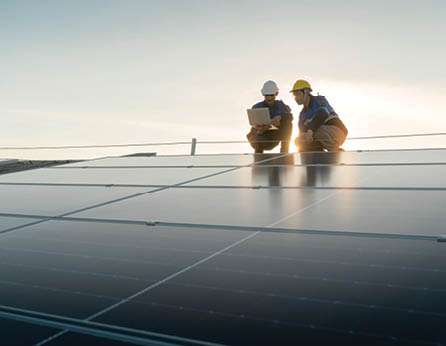 Specialist technician professional engineer with laptop and tablet maintenance checking installing solar roof panel on the factory rooftop under sunlight  Engineers team survey check solar panel roof 
