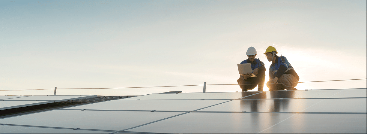 Specialist technician professional engineer with laptop and tablet maintenance checking installing solar roof panel on the factory rooftop under sunlight  Engineers team survey check solar panel roof 