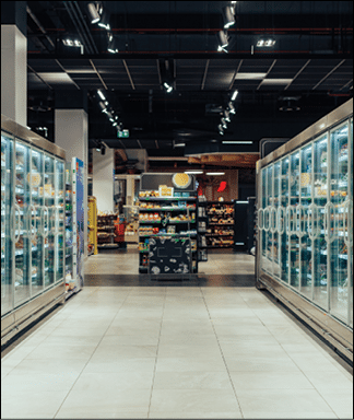 Empty supermarket aisle with freezers showcases with different products