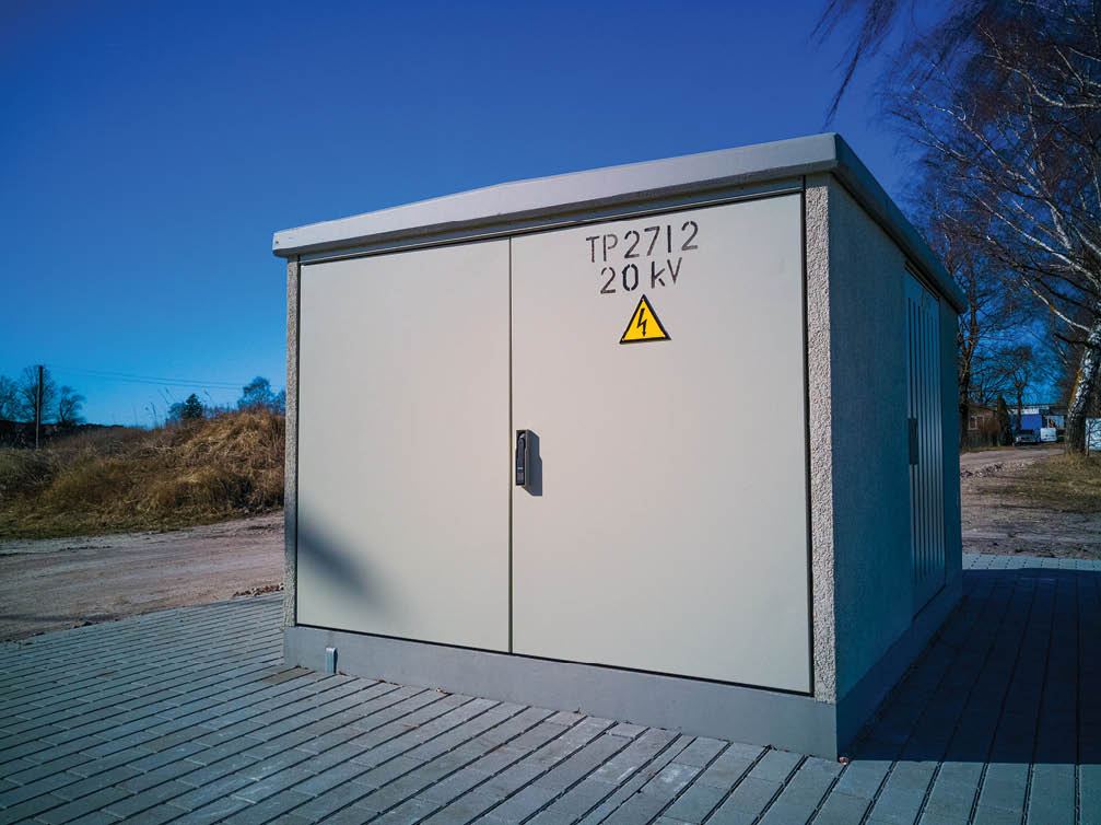 Nice and clean transformer box in a sunny day, with a lot of free space on the door, 20KV