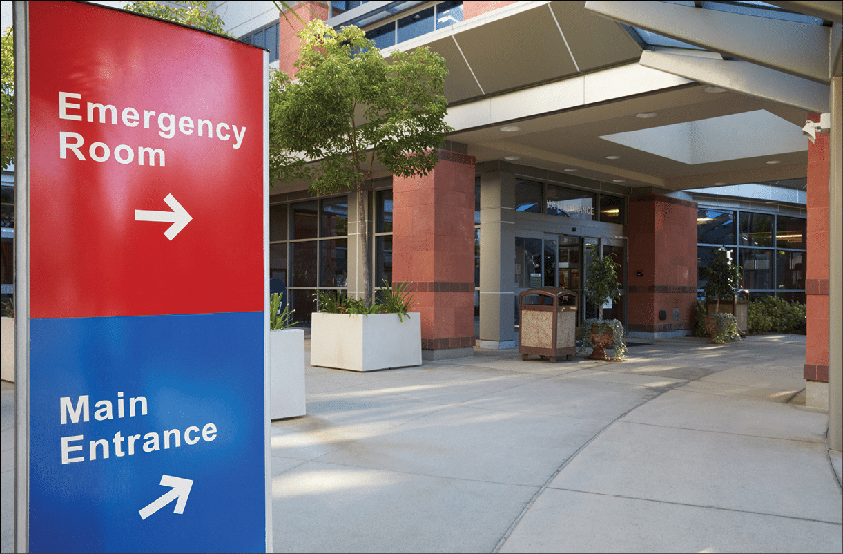Main Entrance Of Modern Hospital Building With Signs