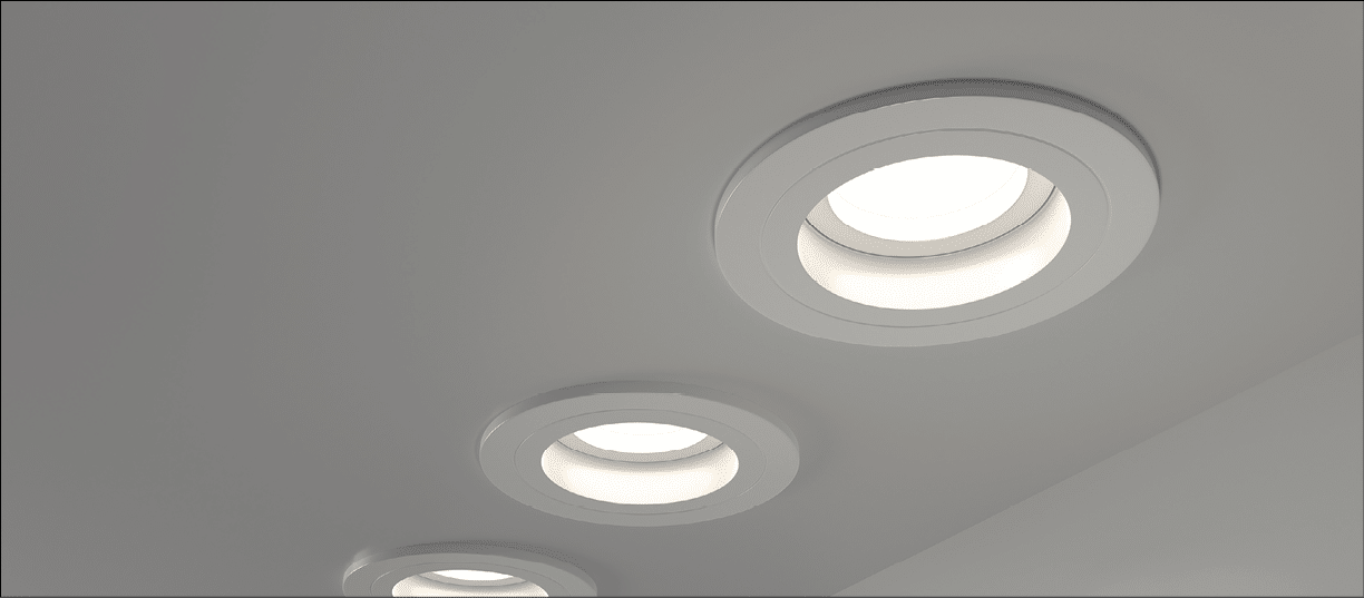 Spotlights recessed ceiling 3D render. Realistic interior room with round glowing downlights at night. Artificial lighting, LED lamps for home or office on dark background angle view, 3D illustration
