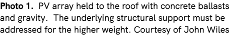 Photo 1. PV array held to the roof with concrete ballasts and gravity. The underlying structural support must be addr...