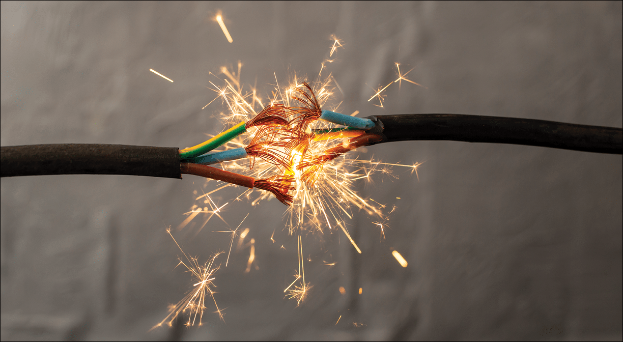 sparks explosion between electrical cables, fire hazard concept, soft focus close up