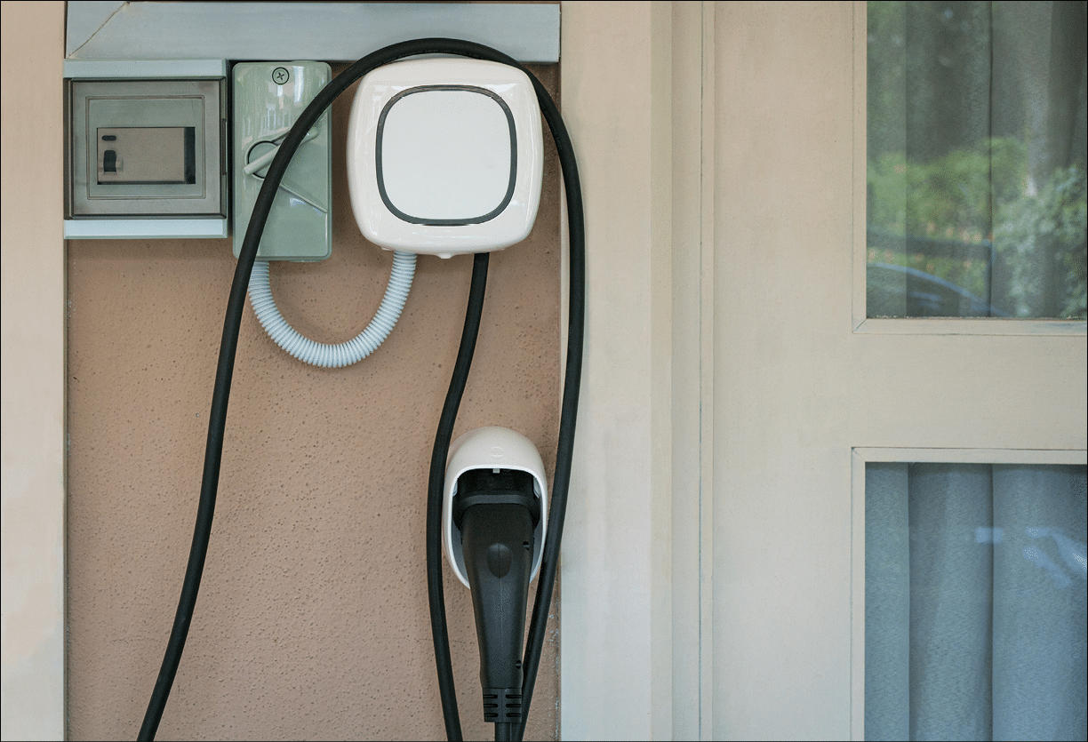 Wall charging station for electric car installed in a residential house.