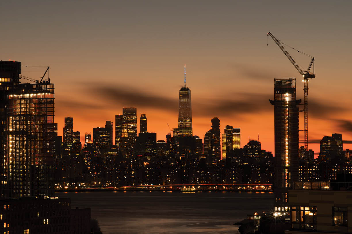 View towards downtown Manhattan at dusk in New York City.