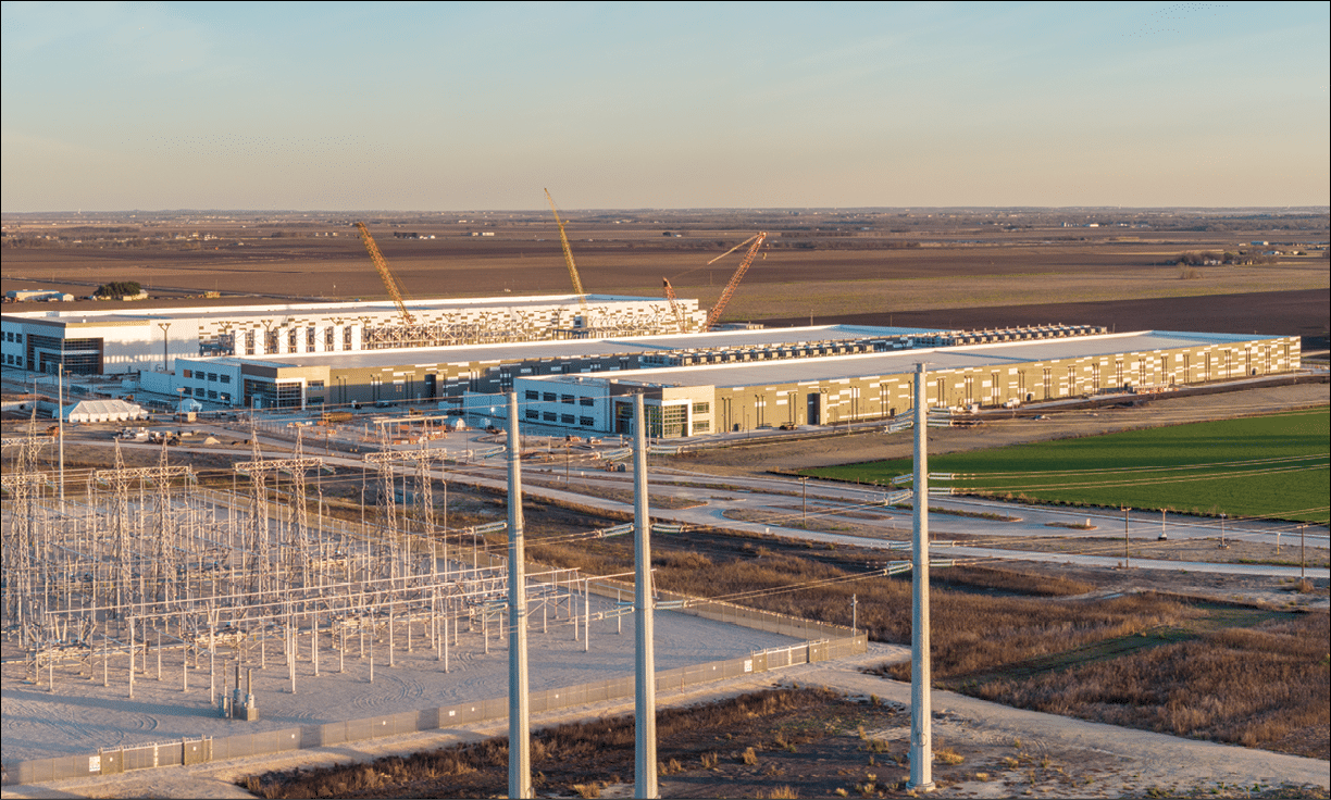 A large building under construction with a crane in the background. Description generated by AI