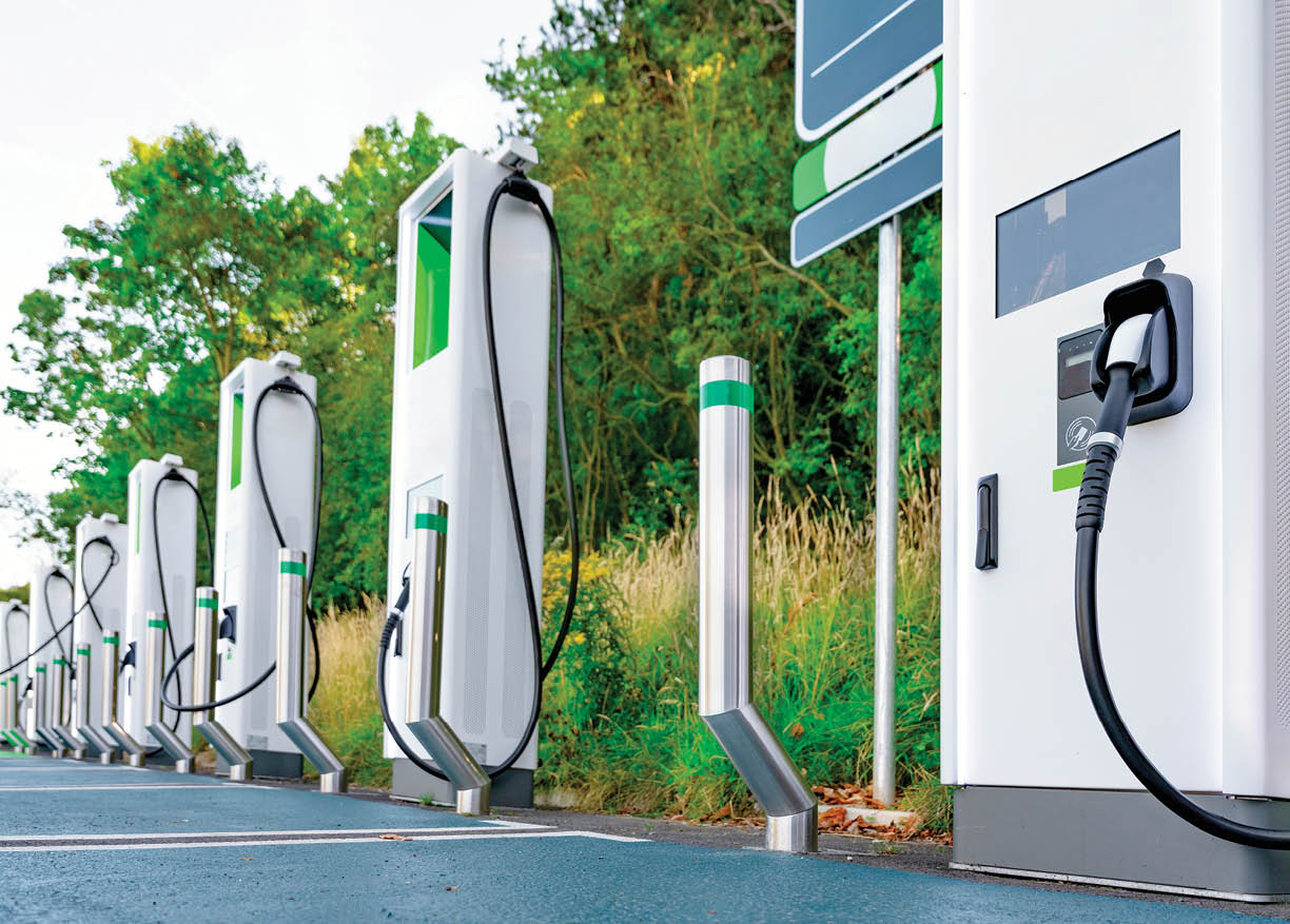 Innovative electric vehicle charging station in a lush green setting showcases modern technology for eco-friendly transportation
